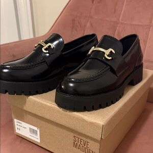 Steve Madden Glossy Black Loafers with Gold Accent
